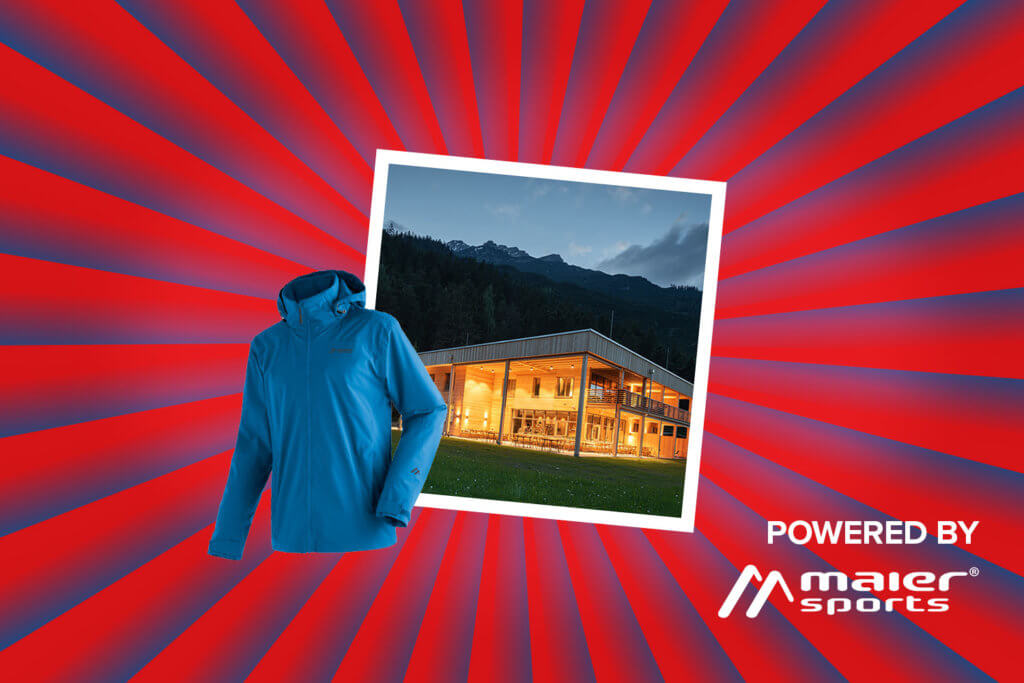 Banner mit rot-blauen Streifen, die sich von der Bildmitte nach außen ziehen. Mitten drin ein Foto, das eine verschneite Aufnahme vom 4-Sterne Hotel LechZeit zeigt. Ebenfalls im Banner sind Symbolfoto einer Maier Sports Wanderjacke sowie ein "Powered by" Schriftzug gefolgt vom Logo der Marke Maier Sports.