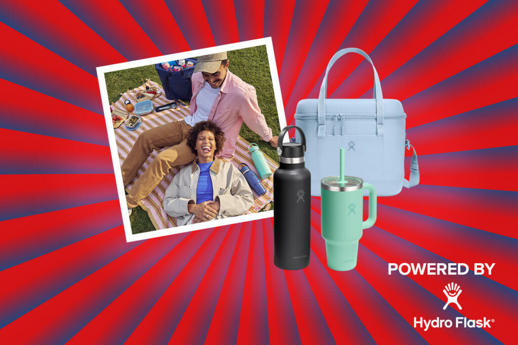Banner mit rot-blauen Streifen, die sich von der Bildmitte nach außen ziehen. Mitten drin ein Foto, das ein Pärchen beim Picknicken zeigt. Ebenfalls im Banner zu sehen sind Produktbilder (Travel Tumbler, Soft Cooler Tasche, Standard Hydro Flask Flasche), und ein "Powered by" Schriftzug gefolgt von dem Hydro Flask Logo.