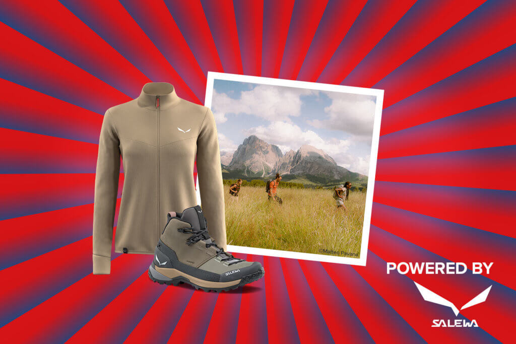 Banner mit rot-blauen Streifen, die sich von der Bildmitte nach außen ziehen. Mitten drin ein Foto, eine Gruppe von Freunden beim Wandern zeigt. Ebenfalls im Banner sind Symbolfotos einer Salewa Wanderjacke und eines Wanderschuhs sowie ein "Powered by" Schriftzug gefolgt vom Logo der Marke Salewa.